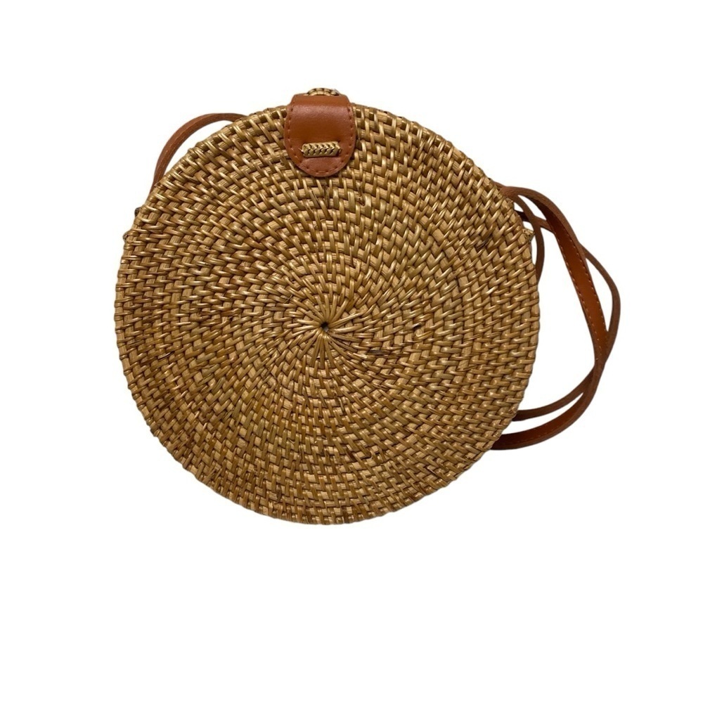 Rattan round small crossbody purse floral lining snap closure.